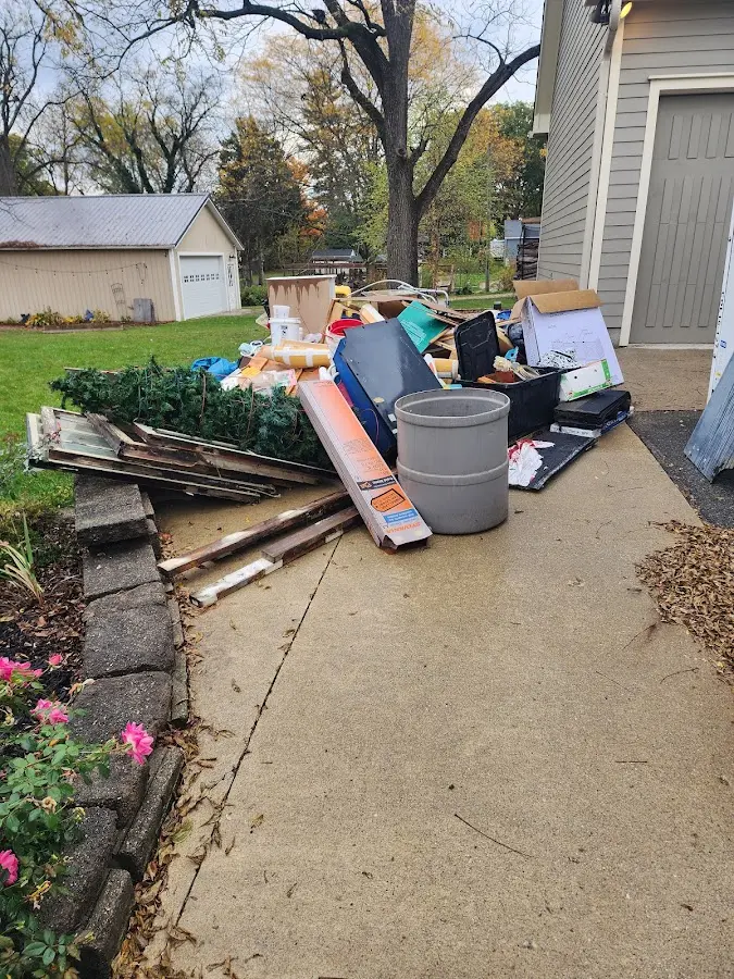 Dumpster being loaded with debris for Commercial Dumpster Rental in Eastern Goleta Valley